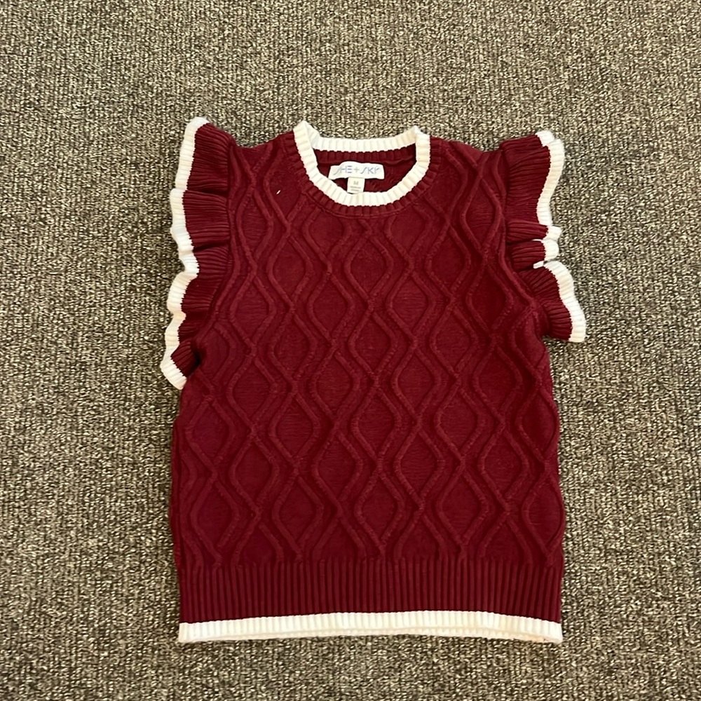Maroon shirt sweater with white trimming